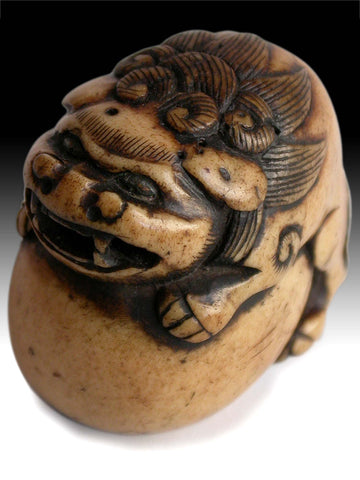 19th Century Japanese Carved Kara Shishi Temple Lion on Ball Stag Antler Netsuke